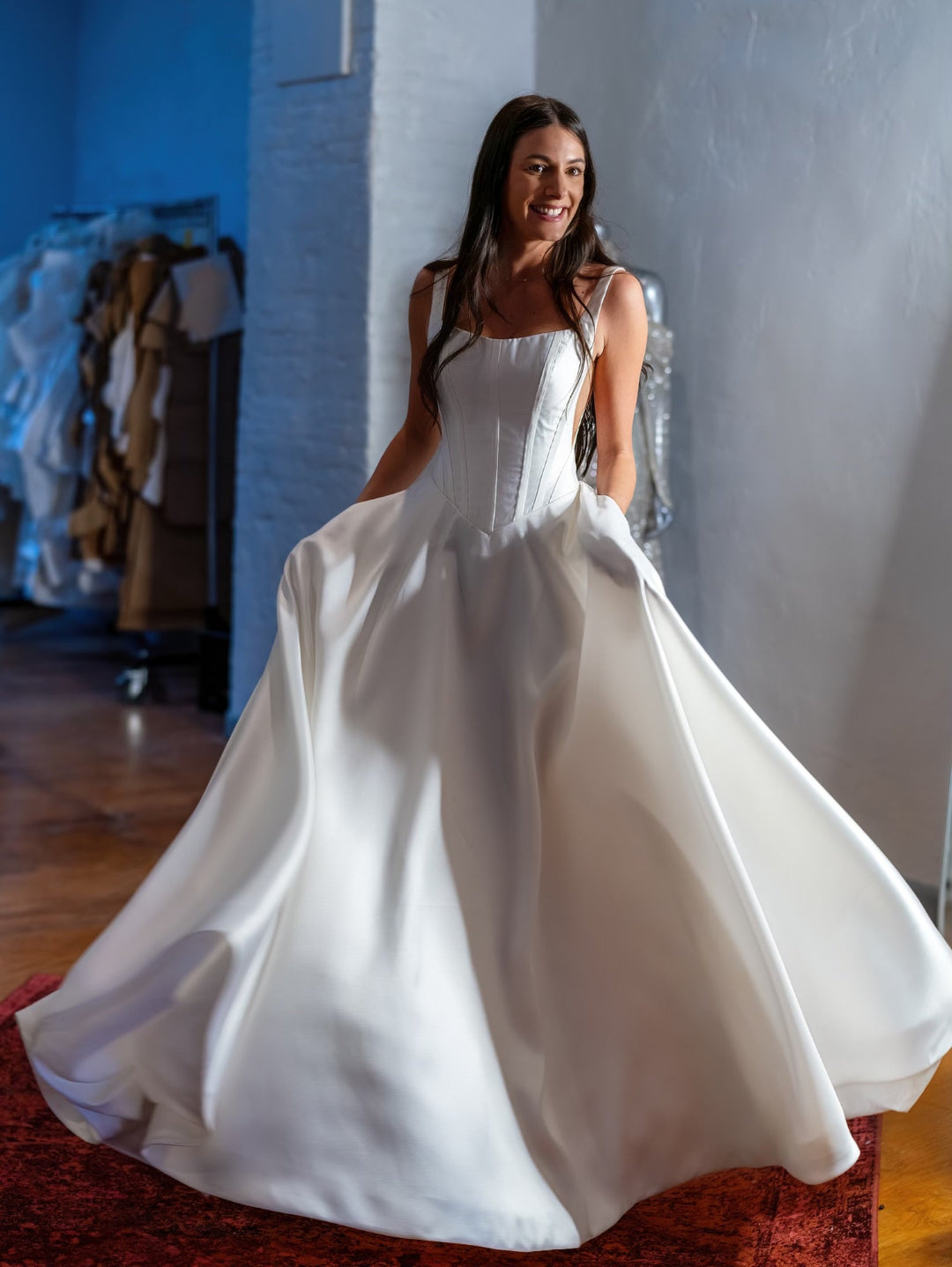 Priscilla Couture client in her custom made wedding dress during fitting