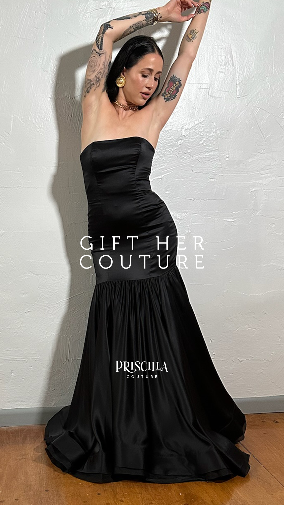 Woman in Priscilla Couture black wedding dress and Gift Her Couture text overlay.