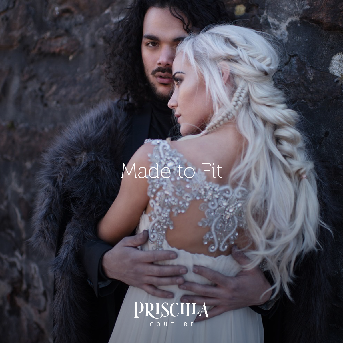 Bride and Groom in a Game of Thrones themed wedding. Bride rearview dressed in a Priscilla Couture wedding dress.