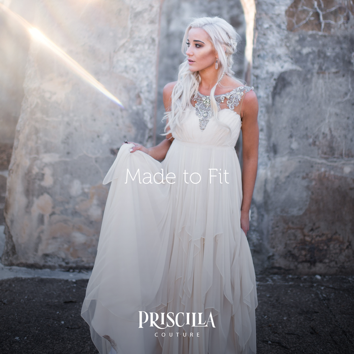 Woman in a Game of Thrones theme wedding. Bride dressed in a Priscilla Couture wedding dress.