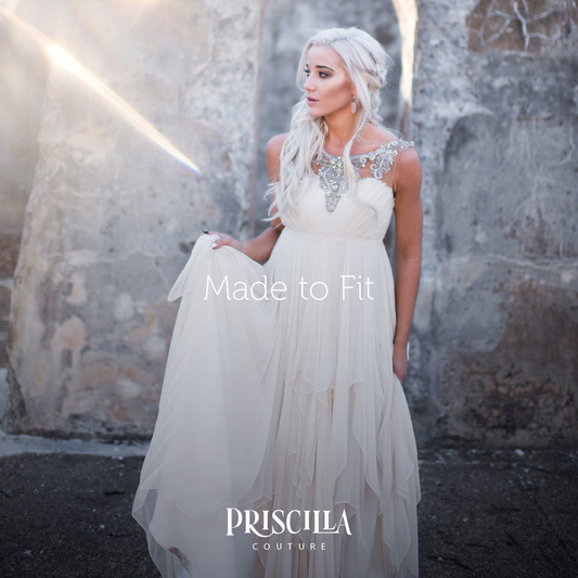 Woman in a Game of Thrones theme wedding. Bride dressed in a Priscilla Couture wedding dress.