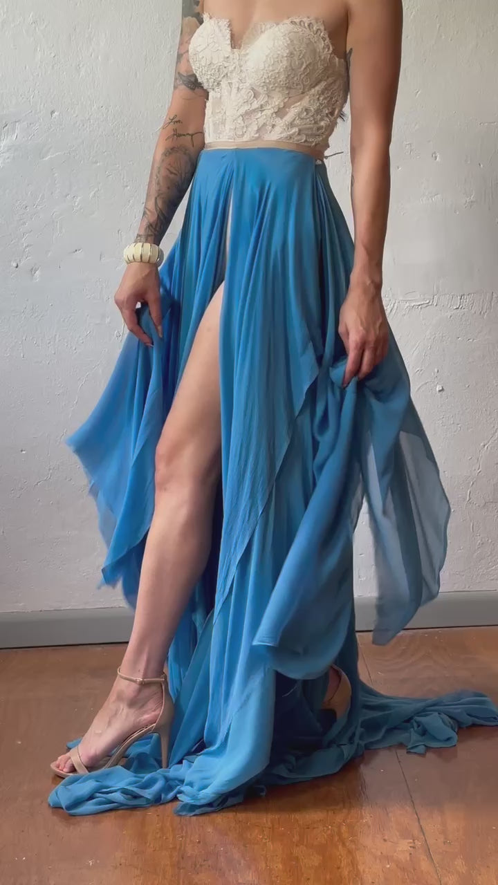 Priscilla Couture fashion model dressed in a layered blue long skirt with a lace top.