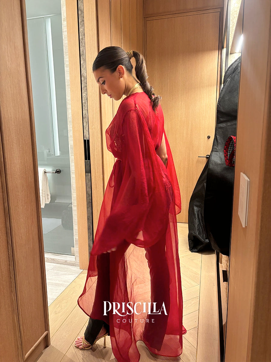 Priscilla Couture model in a long silk organza red robe.
