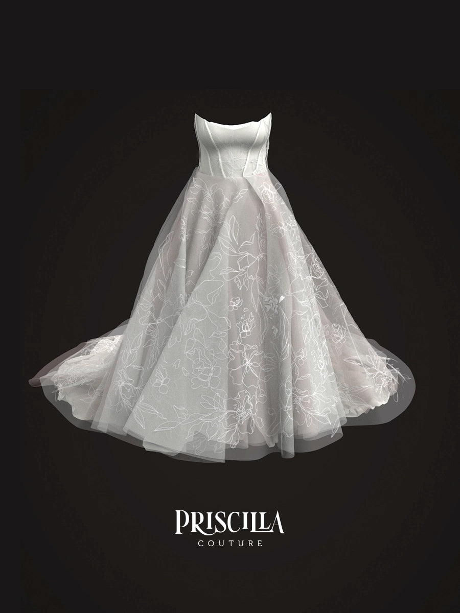 A white strapless wedding gown 3D avatar with a fitted bodice and a voluminous tulle skirt featuring floral lace embroidery, shown against a solid black background with the brand name 'PRISCILLA COUTURE' at the bottom.