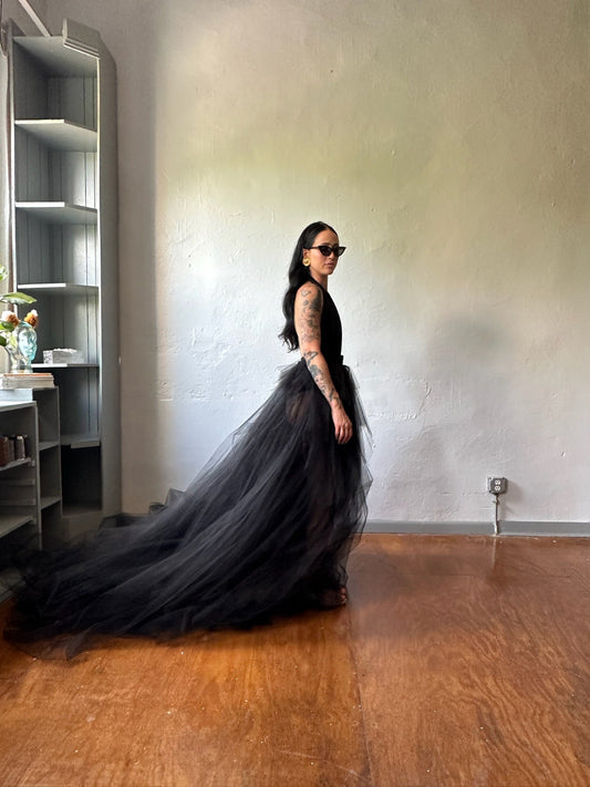 Side view of model wearing a Priscilla Couture black Fabulous bridal skirt