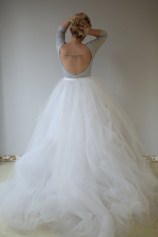 Back view of a model wearing a Priscilla Couture Fantasy white tulle dress