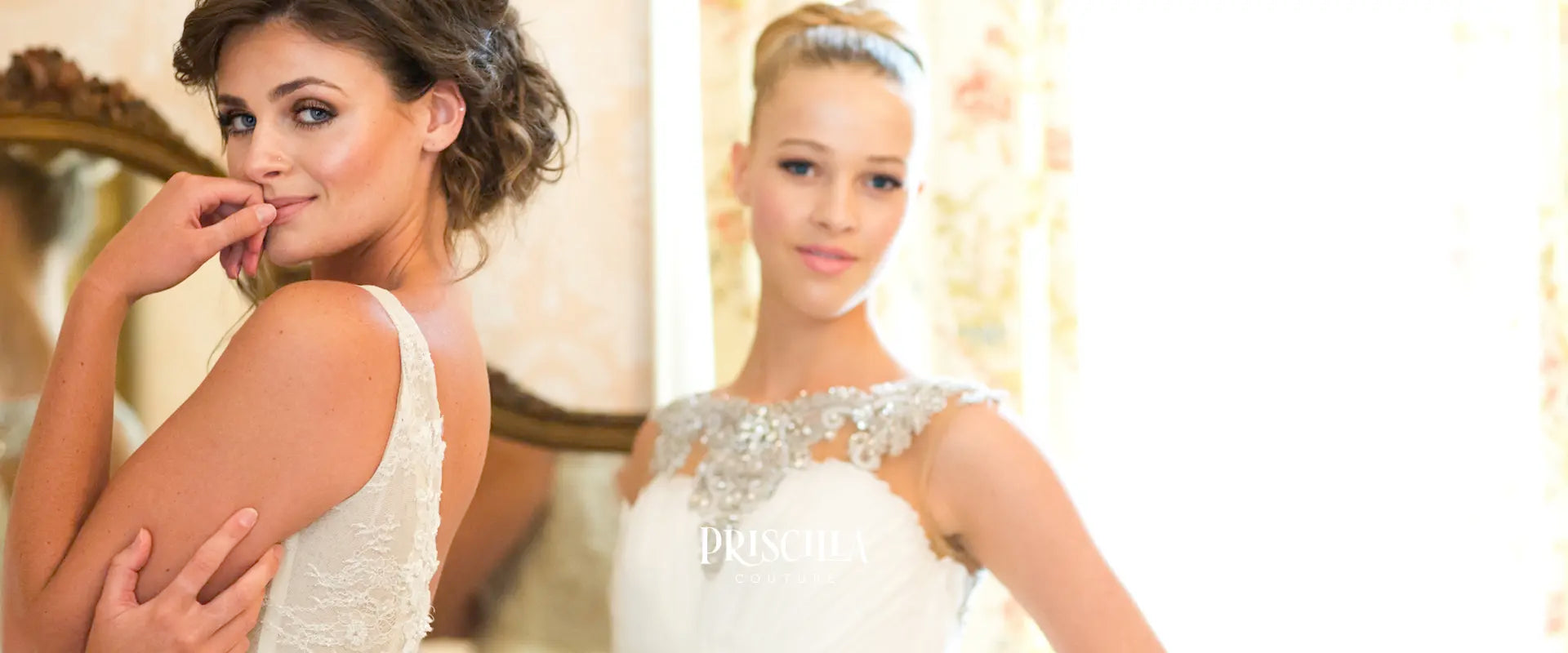 Two women in Priscilla Couture wedding dresses with a blurred background