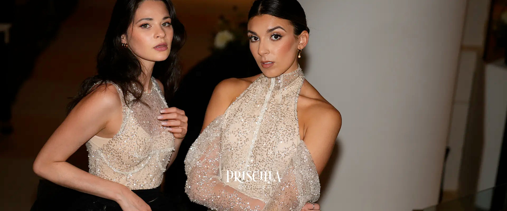 Two Priscilla Couture bridal models in elegant wedding dresses with 'Priscilla Couture' branding.